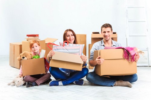 Packed boxes and furniture ready for transport in a Finsbury property