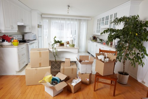 A removals van parked for apartment access in Finsbury with moving equipment