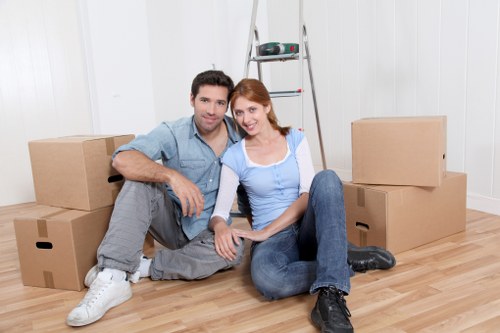 Prepared moving boxes and furniture beside a removals van for Finsbury customers