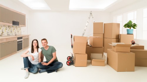 Packed boxes and furniture ready for a house move in Finsbury