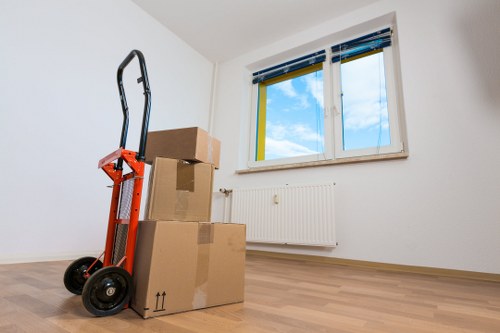 Professional movers handling desks and equipment in Finsbury