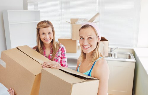 Movers navigating stairs and access challenges in a Finsbury property