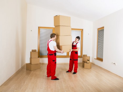 Household boxes and furniture ready for removal in Finsbury
